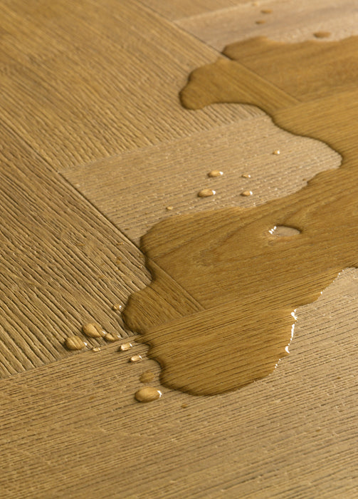 Quickstep | Impressive Design 8mm Laminate Herringbone Cinnamon Oak