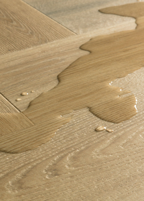 Quickstep | Impressive Design 8mm Laminate Herringbone Charred Oak