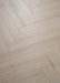 Coretec Authentics Alto herringbone flooring, angled close-up of the surface