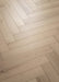 Coretec Authentics Nimbus herringbone flooring, angled close-up of the surface