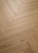 Coretec Authentics Regina herringbone flooring, angled close-up of the surface